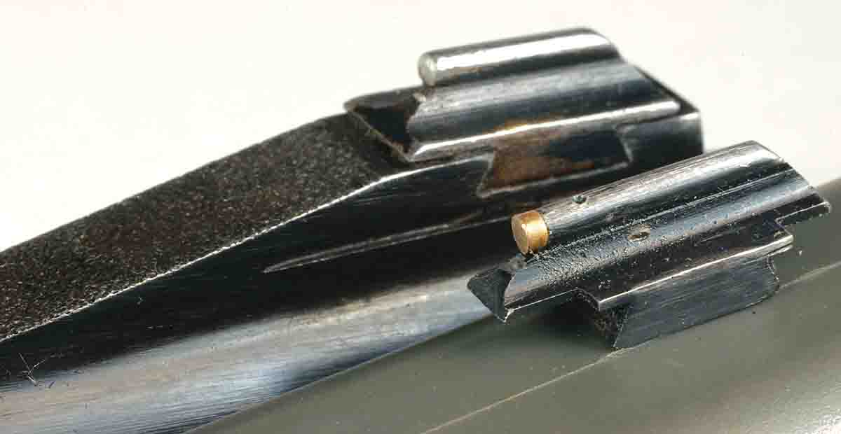 The Lyman No. 31 front sight (bottom) has a .075-inch diameter, flat-faced gold bead compared to the original plain bead on a Winchester Model 94.